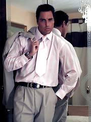 Hunky Marcello takes off his suit and plays with his huge cock - Gay porn pics at Gaystick