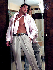 Hunky Marcello takes off his suit and plays with his huge cock - Gay porn pics at Gaystick