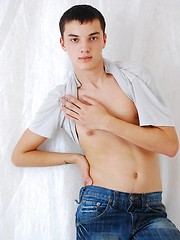 Handsome twink on the floor posing and stripping - Gay porn pics at Gaystick