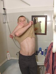 Tattooed twink rubs his muscled ass in the shower - Gay porn pics at Gaystick