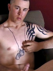 Kenny sits in a chair with his legs spread and puts on a good first show - Gay porn pics at Gaystick