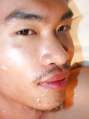 Asian guy Vodga is receiving a hot golden shower from his friend before facial - Gay porn pics at Gaystick