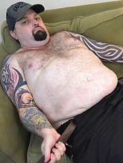 Hairy, tattooed love-stud Rowdy Hixxx strips to show you his furry belly and uncut cock - Gay porn pics at Gaystick
