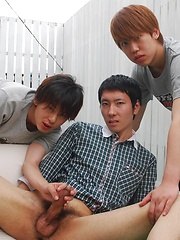 Kaede and Fuji grab the lube and a dildo and bend Jo over the small couch pulling off his shorts - Gay porn pics at Gaystick