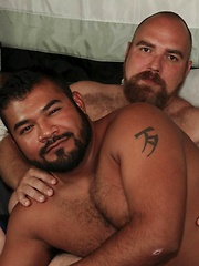 DJ pushes Rico down on the bed and fingers his hole with his meaty digits - Gay porn pics at Gaystick
