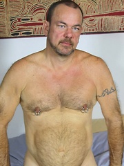 Stephen Edwards is one sexy barrel-chested bear with his pretty green eyes, beard, muscular body and hairy chest - Gay porn pics at Gaystick