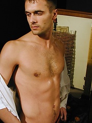 Ripped stud Ronny strokes his cock on the bed. - Gay porn pics at Gaystick