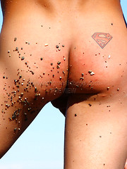 Superboy Alec relaxing on the beach - Gay porn pics at Gaystick
